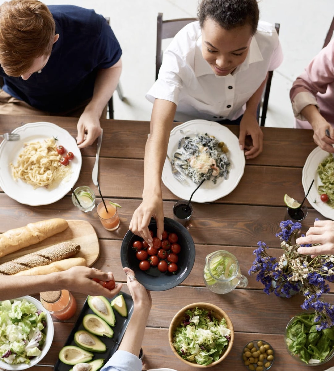 Family eating dinner at a large Table